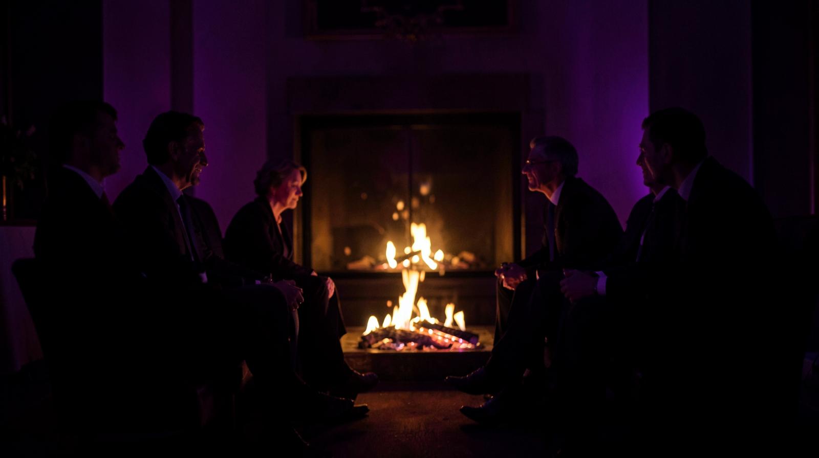 Guests in a private fireside conversation